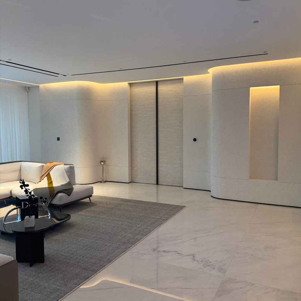 Curved feature wall with textured decorative paint in Dubai interior