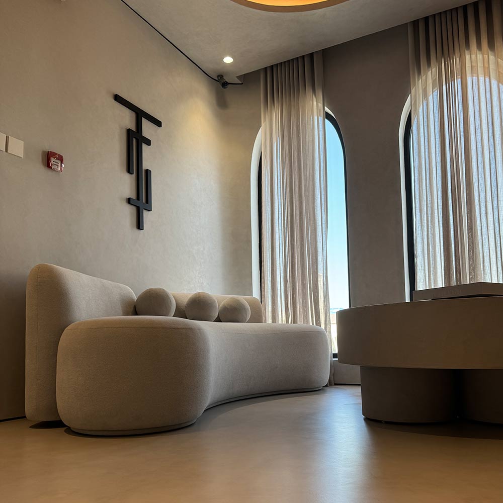 Decorative paint and seamless microcement finish on walls and floors in UAE interior