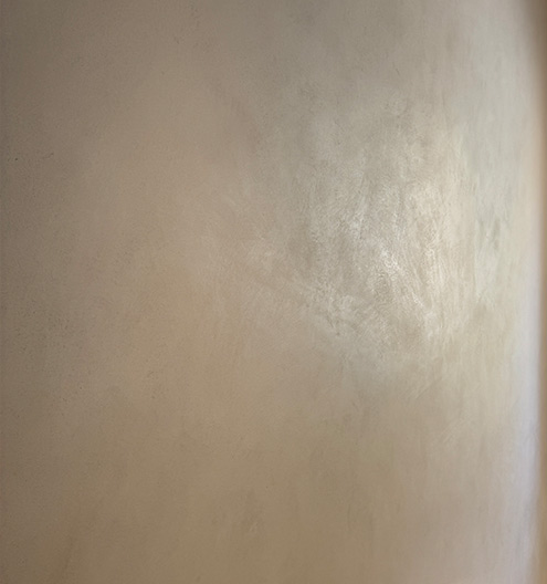 Natural clay lime plaster with earthy tones and matte texture for sustainable interior finishes in the UAE