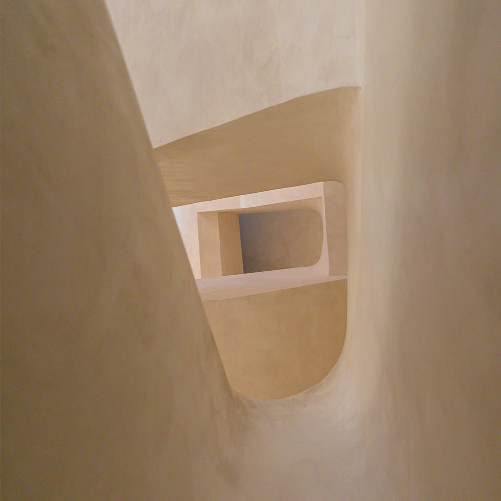 Close-up of microcement on curved staircase in Dubai café