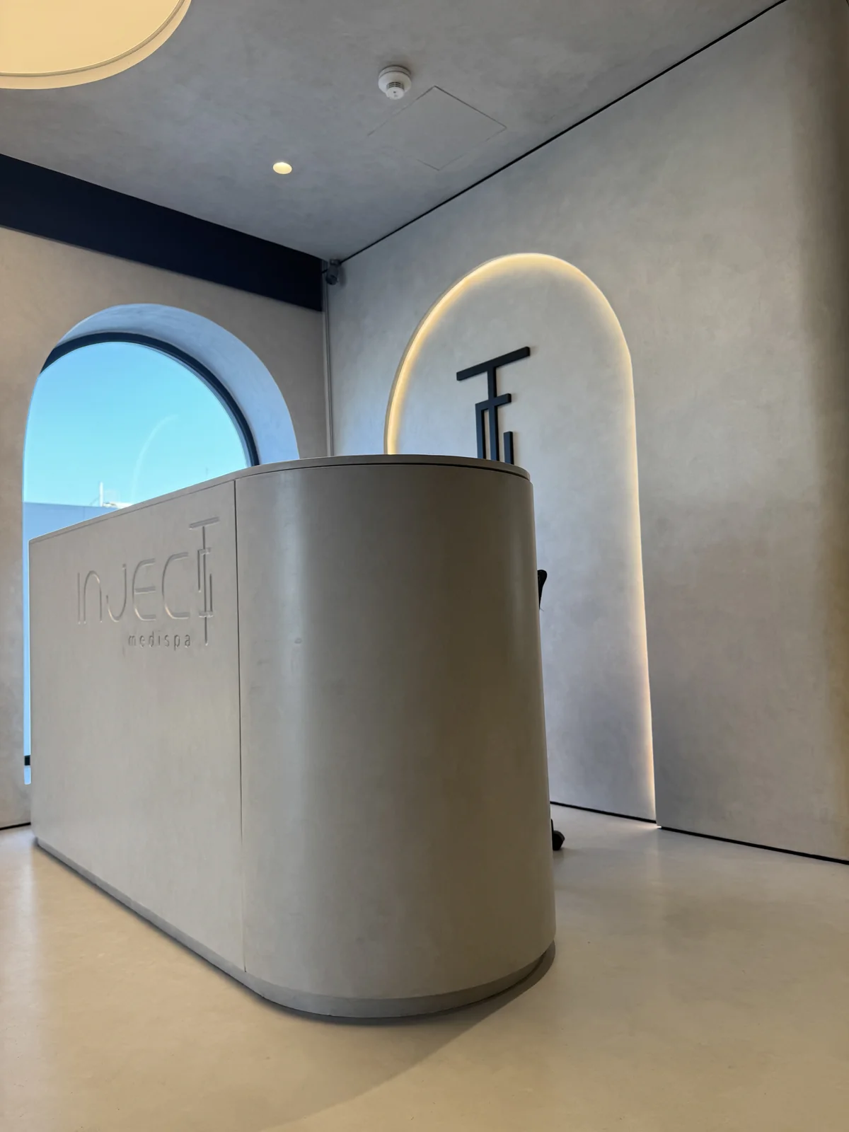 Soft wall finish around a curved reception area
