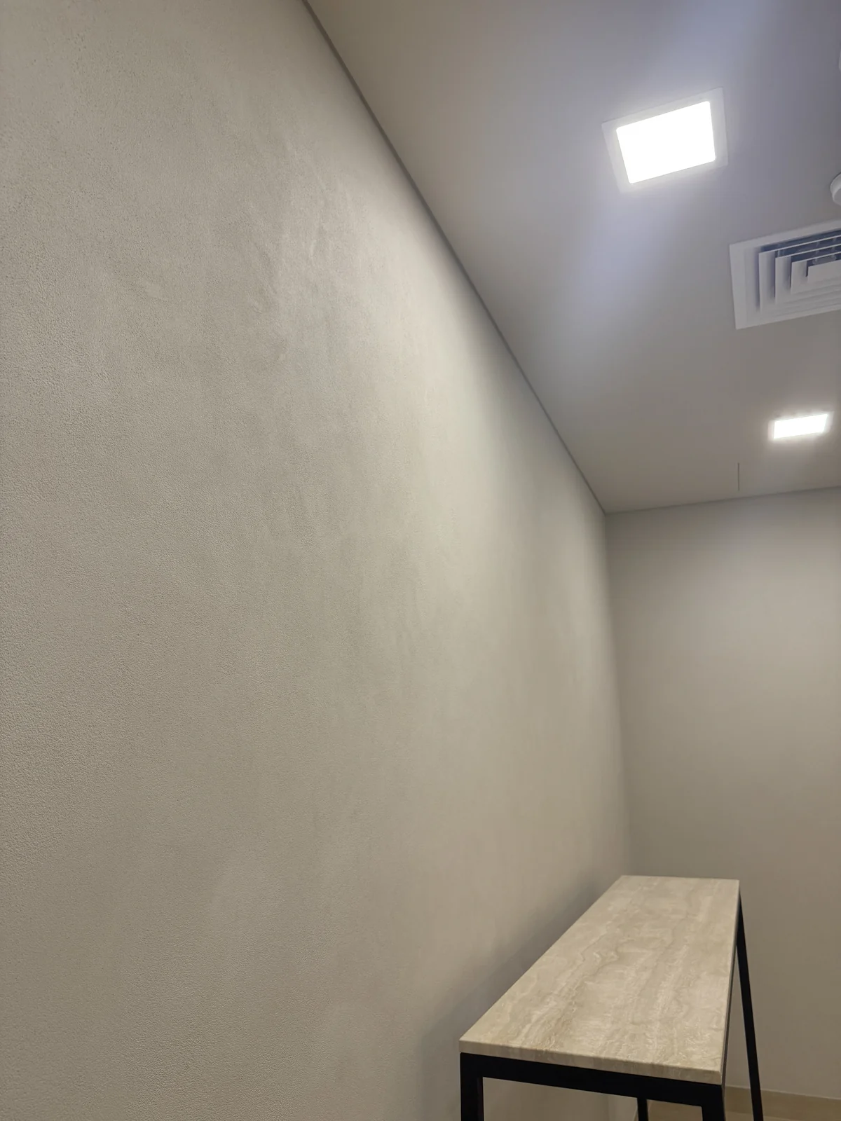 Quiet tonal variation along a light interior wall