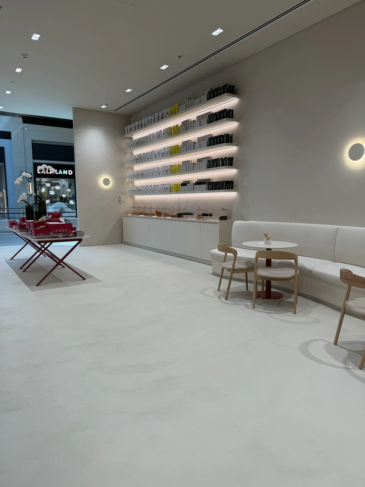 Soft grey flooring within a café interior