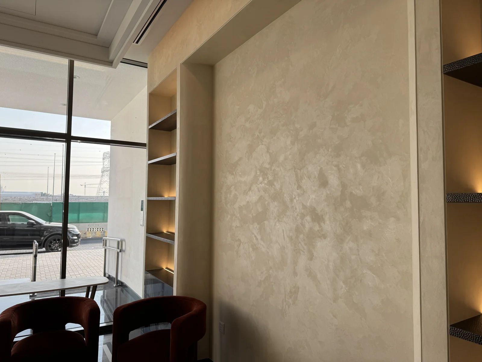 Warm velvet-effect wall finish in a seating area