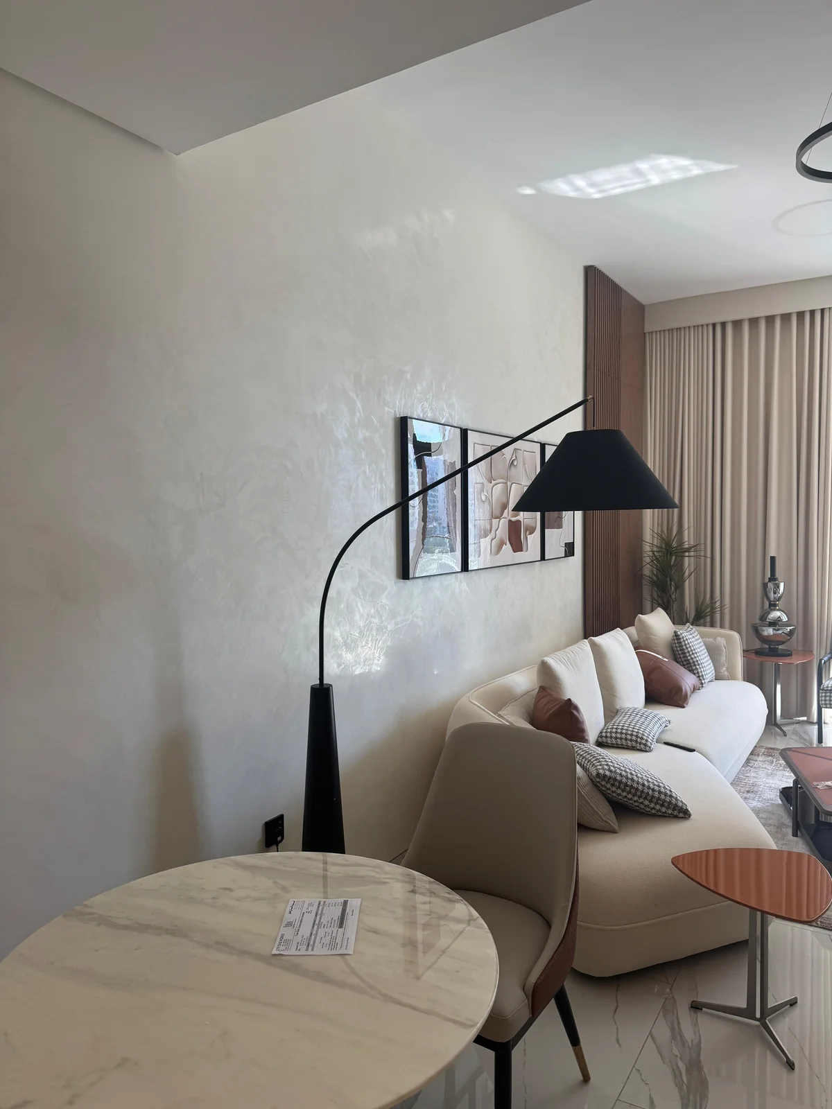 Polished stucco wall reflecting light in a living area