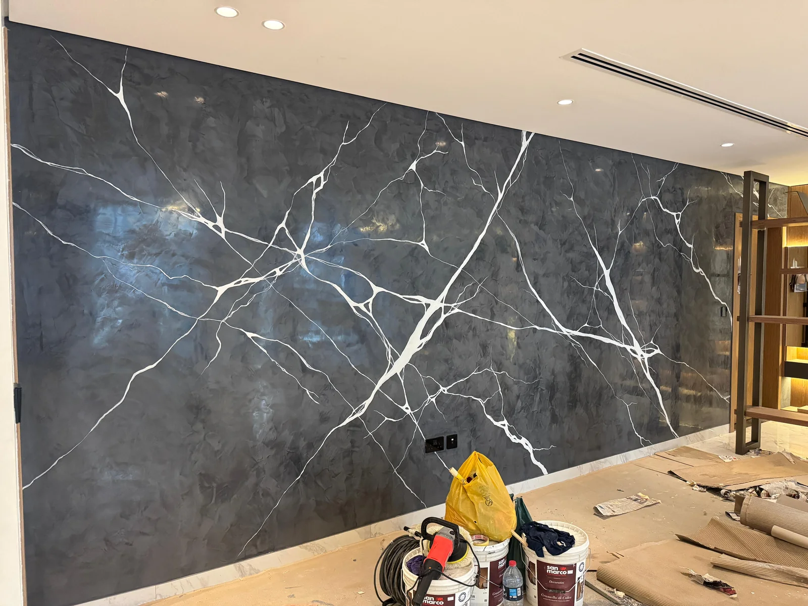 Bespoke dark marble-effect finish during installation