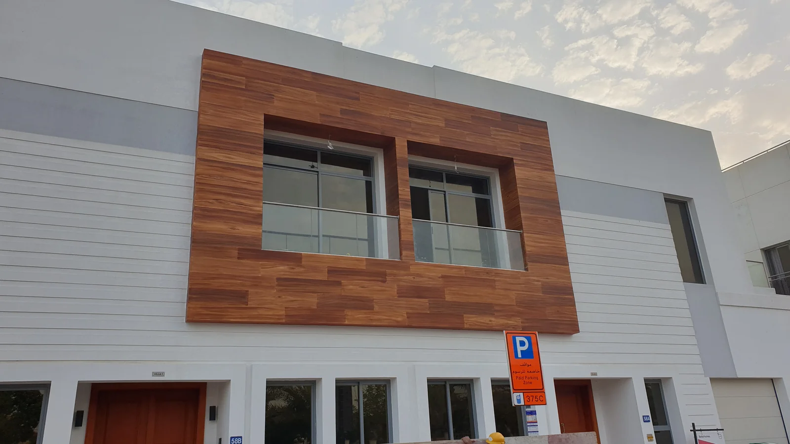 Warm wood-effect framing around upper-level windows